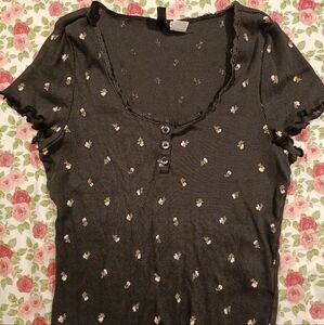 Floral coquette lettuce hem top